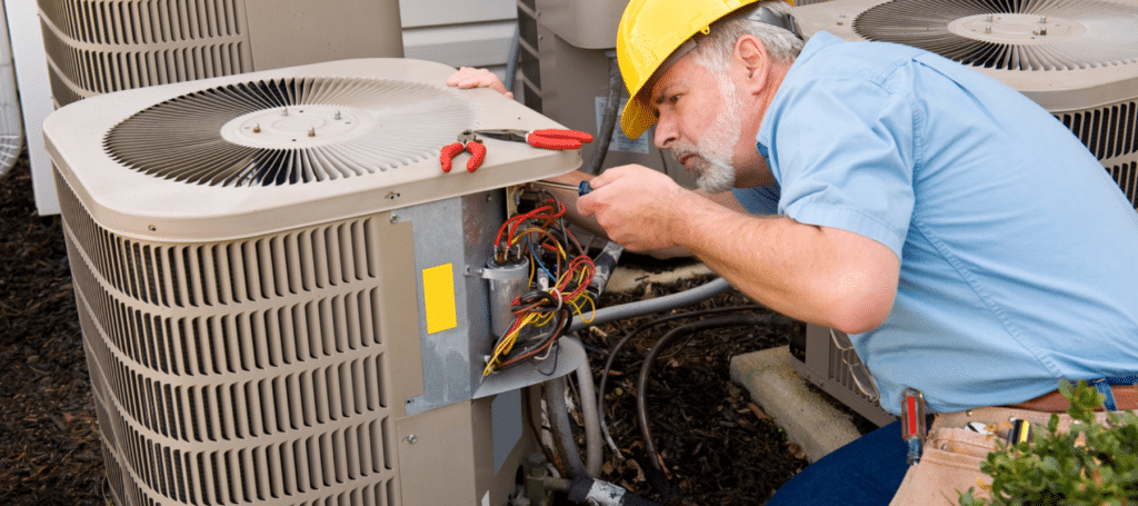 Technician repairing an outdoor AC unit with tools and wires exposed, HVAC technician diagnosing emergency cooling failure with gauges and electrical testing tools