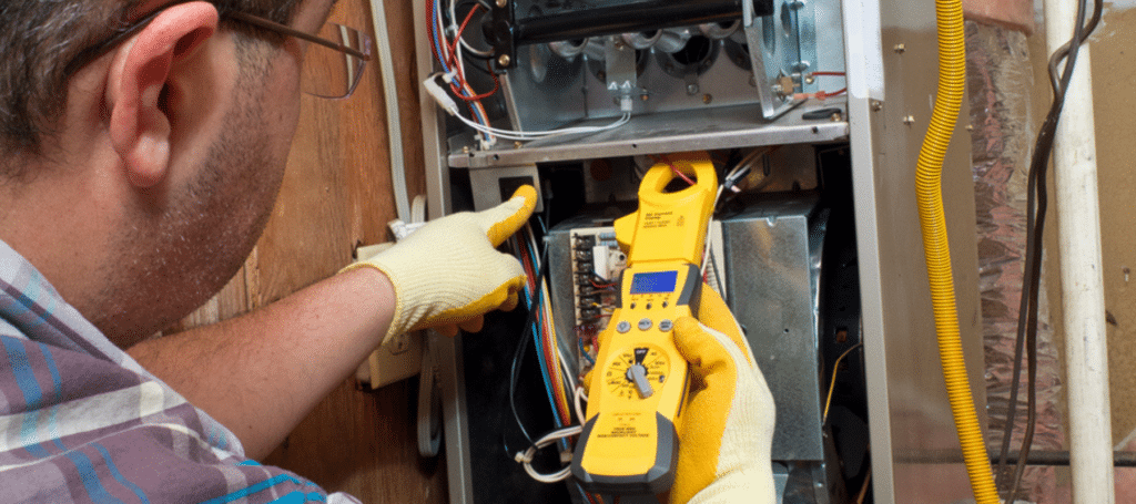 A technician using a diagnostic tool to inspect and service a furnace, ensuring proper functionality, Experienced technician testing AC system components with professional diagnostic equipment
